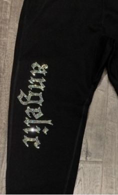 "Clear Rhinestones Joggers (Angelic). These are very shiny rhinestones and have 2 front pockets and 1 back pocket. The back pocket ha a cross and \"Angelic\" is on the front side. Very comfortable Unisex. Angelic is about 12\" long. * 8.25 oz ., 80% ringspun cotton / 20% polyester * Amazing lofty hand feel and best in class under 5% shrinkage" Rhinestone Cross, Comfy Fits, Clear Rhinestones, Zip Ups, Angel