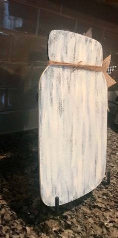 a white refrigerator sitting on top of a counter