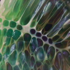 an abstract painting with green and purple colors