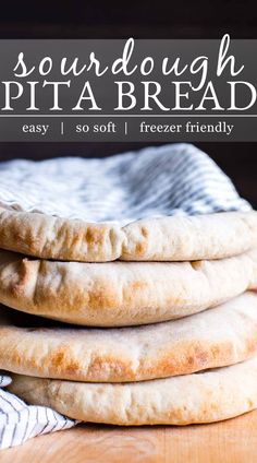 three pita breads stacked on top of each other with text overlay reading sourdough pita bread easy, so soft, freeze friendly