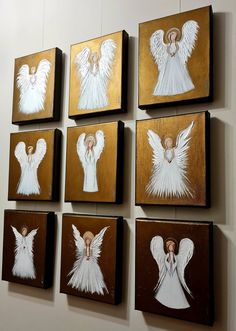 six framed angel pictures hang on the wall