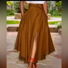 New Brown Maxi Luxury Tiered Skirt Midi Dress For Daywear, Brown Solid Color Long Skirt, Brown Solid Color Midi Skirt, Chic Brown Full Skirt, Relaxed Fit Brown Skirt, High Waist Solid Color Skirt For Day Out, Casual Brown Asymmetrical Skirt, Elegant Brown Skirt With Pockets, Brown Asymmetrical Maxi Skirt For Spring