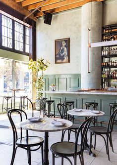 an empty restaurant with tables and chairs