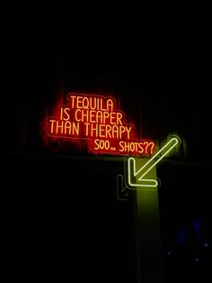 a neon sign that says tequila is cheaper than therapy so do shots? in the dark