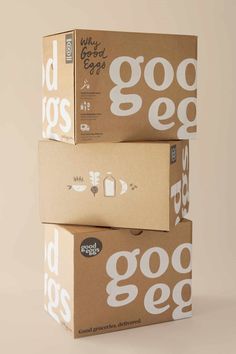 three boxes stacked on top of each other with the words good egg printed on them