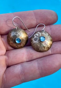 From Jeff's Rustic Collection an eye catching pair of hammered brass drop dangle earrings, with sterling ear wires. Hammered Brass, Drop Dangle Earrings, Phoenix Az, An Eye, Ear Wires, Blue Topaz, Phoenix, Topaz, Dangle Drop Earrings