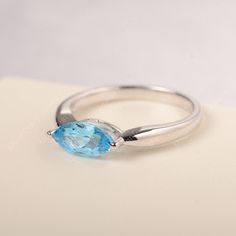 All HANDMADE ITEMS SHIP IN APPROX 8 DAYS Main Stone: Genuine Swiss blue topaz Main Stone Size: Marquise cut 5 mm x 10 mm Main Stone Weight: 1.29 carat Side Stone: None Height From The Ring Setting Bottom(to gemstone top): about 5.10 mm Width of Ring band Measure: gradually varied,about 2.12 to 2.63 mm Material: .925 Sterling Silver/14K White Gold/14K Yellow Gold/14k Rose Gold Engraved: Available For FreeNo more than 13 letters) Customized:Of course! Tell me what you want Includes With Order: All Marquise Cut Topaz Ring For Anniversary, Marquise Topaz Ring With Prong Setting For Promise, Marquise Topaz Promise Ring, Marquise Topaz Ring For Promise Occasion, Marquise Topaz Ring With Center Stone As Gift, Classic Marquise Topaz Ring For Gift, Marquise Topaz Promise Ring In Fine Jewelry Style, Marquise Blue Topaz Ring For Promise, Gift Marquise Topaz Ring With Prong Setting