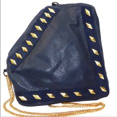 Look Adventurous And Unstoppable Day Or Night With This Beautiful Heroic Leather Handbag. With It's Eye Catching Pentagon Shape And Golden Studs, You Will Be Sure To Make A Fashion Statement. Feel Empowered And Confident Throughout The Day. Constructed With 100% Genuine Leather. Handcrafted In The Usa Blue Leather Shoulder Bag For Party, Blue Leather Party Bag, Designer Clutch Bag For Night Out, Blue Party Bags With Gold-tone Hardware, Pentagon Shape, Feel Empowered, Design Bags, Leather Handbag, Fashion Statement