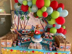 a birthday party set up with balloons and decorations