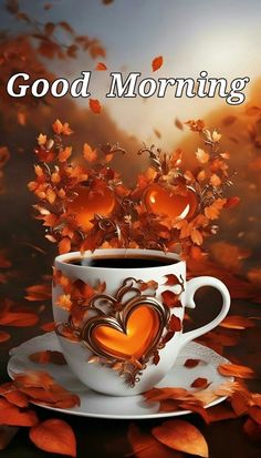 a coffee cup filled with hearts on top of a saucer next to autumn leaves