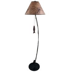 a floor lamp with a brown shade on the top and a black base, sitting on a white background