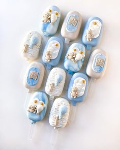 there are many blue and white toothbrushes with teddy bears on them