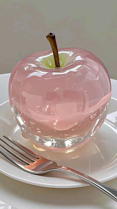 an apple on a plate with a fork