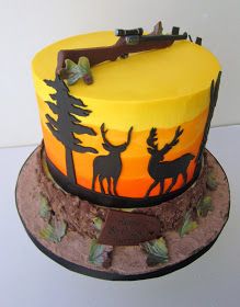 there is a cake decorated with deer and trees