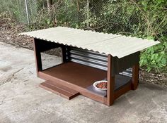 a dog house with a bowl of food in it