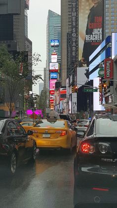 cars are driving down the street on a rainy day in new york city, ny