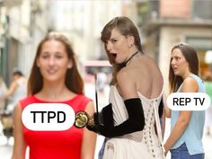 two women in dresses and one is holding an object with the word tpp on it