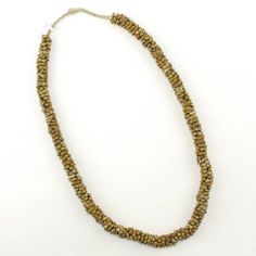 "Collectible Old Brass Baule Charms from West Africa. This strand is approximately 33\" long - and each charm is about 6 x 12 x 10mm. Pictures show a variety of beads and their condition which is typical of antique collectible beads - beads are not in new and perfect shape. This listing is for the strand pictured. *Colors may vary due to batch, monitor color etc. See my other Collectible African Trade Beads in my shop for more fabulous old treasures!" Antique Polished Gold Beads, Antique Gold Polished Beads, Bohemian Single Strand Gold Beads, Traditional Rondelle Single Strand Beads, Gold Rondelle Hand-strung Necklaces, Traditional Single Strand Rondelle Beads, Traditional Single Strand Gold Beads, Traditional Gold Single Strand Beads, Artisan Single Strand Gold Beads