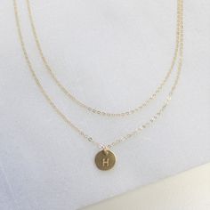 "Dainty Necklace - layered set of Two Simple and classic this layered set is the perfect compliment to your favorite tee or little black dress. This beautiful set is available in silver, gold or rose. D E T A I L S -Top layer - dainty link chain -Bottom layer- tiny disc measures 8mm -Choose 14kt Gold-Filled, Sterling Silver, or Rose Gold-Filled. -A high quality delicate link chain. -Polished to a light satin finish. CUSTOM HAND STAMPING -Hand stamped with an initial or heart. -This disc can also Double Chain Round Necklaces For Layering, Dainty Double Chain Round Necklace, Dainty Round Necklace With Double Chain, Everyday Layered Double Strand Charm Necklaces, Dainty Layered Choker Necklace As Gift, Dainty Layered Choker Necklace For Gift, Minimalist Layered Double Strand Jewelry, Layered Double Strand Minimalist Jewelry, Everyday Layered Choker Jewelry