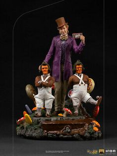 a figurine of three men dressed up as clowns