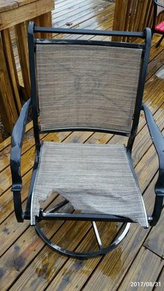 a chair sitting on top of a wooden deck