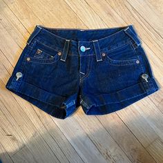 New Never Worn True Religion Brand Denium Shorts Size 24. Dark Blue And Cuffed With Button Short Blue Jeans With Buttons, Blue Short Bottoms With Buttons, Blue Shorts With Buttons, Casual Short Bottoms With Button Cuffs, Casual Shorts With Button Cuffs, True Religion Shorts, Studded Shorts, Grey Trench Coat, Adidas Track Suit