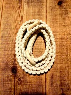 a white rope on top of a wooden table