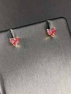 These gorgeous Lab Grown Heart Shaped Pink Diamond Stud Earrings are 0.85 carat in total weight, in the color pink and VS2 clarity with the most excellent sparkle. Each v-end prong setting is handcrafted in glistening 14K gold, in either push back or screw back closure. The optimal symmetry and polish of the diamonds ensures maximum brilliance. This pair of earrings is charming, enchanting, sustainable and will add timeless beauty to any outfit and occasion. LAB GROWN Heart Shaped Fancy Pink Dia Fine Jewelry Heart-shaped Gia Certified, Valentine's Day Heart Cut Diamond Earrings With Prong Setting, Rose Gold Heart Cut Earrings, Heart Cut Diamond Earrings With Prong Setting, Valentine's Day Vvs Clarity Diamond Earrings, Gia Certified Fine Heart Shaped Jewelry, Fine Jewelry Gia Certified Heart-shaped, Gia Certified Heart-shaped Jewelry For Valentine's Day, Gia Certified Heart-shaped Fine Jewelry