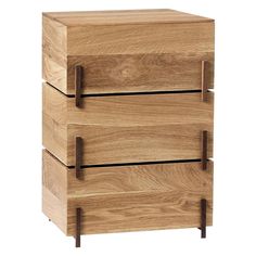 three wooden drawers stacked on top of each other