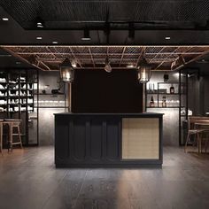 an empty bar with stools and shelves in the back ground, lit by lights