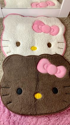 two hello kitty rugs sitting on the floor