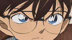 an anime character with glasses staring at the camera