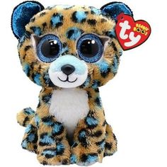 a small stuffed animal with big eyes and a tag on it's ear, sitting up against a white background