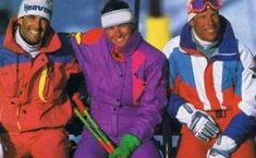 three skiers are posing for the camera