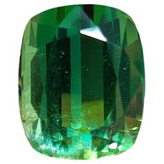 A massive, mesmerizing 8.88 Carat Tourmaline stone that is vivid green in color. It is completely natural and of good quality. The tourmaline piece is cut into perfection in a cushion-cut shape. The orange tourmaline has not undergone any form of treatment. The measurements of the Tourmaline are 12.84mm x 10.40mm x 8.15mm. The stone is authenticated and does come with a certificate as well. Please feel free to contact us for more information regarding this. If you wish to get a custom jewelry pi Tourmaline Stone, Tourmaline Gemstone, Green Tourmaline, Cushion Cut, Semiprecious Stones, Good Quality, Custom Jewelry, Precious Stones, Tourmaline