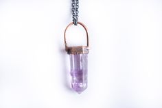 Amethyst necklace | Polished amethyst necklace | Amethyst pendant | Raw crystal statement jewelryThis listing is for one small polished amethyst crystal electroformed and strung on a 24" copper chain "dipped" for an ombre finish.This necklace does not have a clasp. It is designed to slip on over the head. Our jewelry is unique and one-of-a-kind. Please note there will likely be variances in the size, shape and color of each stone. All elements of your piece are handcrafted in our tiny studio on Purple Electroformed Amethyst Jewelry, Electroformed Amethyst Crystal Necklace As Gift, Tiny Studio, Necklace Amethyst, Electroformed Jewelry, Crystal Bangle, Peridot Ring, Copper Chain, Amethyst Necklace