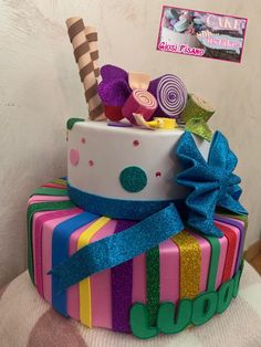 there is a multi layer cake decorated with candy