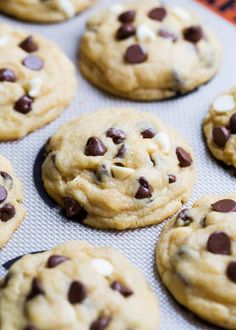 chocolate chip cookies with white and brown chips on a baking sheet, ready to be baked