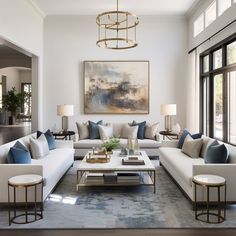 a living room with couches, tables and lamps in it's center area