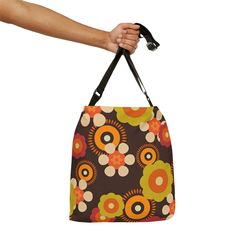 Suit up for the summer in style with our 70's Hippie Mod Daisy tote bag. This Chocolate Brown, Retro Adjustable Tote Bag is sure to make a statement wherever you go. Brilliantly constructed with 100% spun polyester, two sizes and an adjustable strap, it's the perfect accessory to bring along on your summer adventures! Plus, with a zippered closure, black interior lining and inner pocket, you'll feel safe and secure while you're out and about. So don't wait – grab yours today and get ready to tur Retro Square Shoulder Bag For Everyday, Retro Everyday Shoulder Bag, Retro Shoulder Bag For Everyday Use, Square Retro Shoulder Bag, Summer Retro Shoulder Bag For Shopping, Retro Shoulder Bag For Shopping, Retro Square Shoulder Bag For Travel, Retro Summer Square Shoulder Bag, Retro Square Bags For Summer