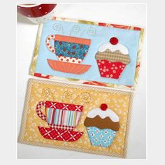 two quilted placemats with cupcakes and coffee cups on them