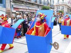 some people are walking down the street in costume