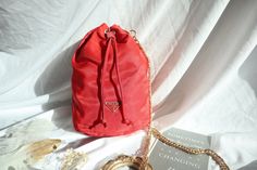 - Brand : Prada  - Luxury brand items - Authentic Prada Red  Nylon Tessuto Small Bucket Drawstring Bag - Silver-tone hardware - Made in Italy - Size: W 16.5 cm x H 21.5 cm x D 10 cm - Come wih a chain strap, not original Prada's chain strap ( for variety of use) - Overall in very good condition - With our own store packing will be included - Guaranteed 100% authentic - Free Shipping - We shipped worldwide! {Gentle Reminder} - Vintage Luxury Brand Store from Hong Kong - Pre-loved vintage item, mi Luxury Brand Store, Prada Mini Bag, Prada Hobo, Prada Mini, Prada Red, Wedding Bags, Bag Prada, Small Buckets, Prada Nylon