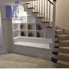 there is a book shelf under the stairs