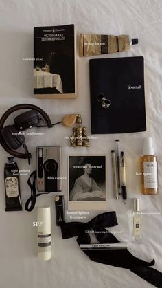 books, perfume, hand cream, film camera, hairspray, spf, and headphone Dark Academia Headphones, Hand Cream Aesthetic, Headphones Outfit, Summer Bag Essentials, Marshall Headphones, Mini Perfumes, Film Recommendations, Aesthetic Backpack