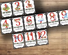 the numbers are displayed for this printable christmas card game set up on a wooden table