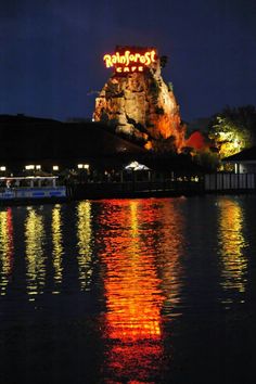 a large body of water at night with lights on it