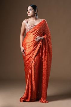 Orange, coral and peach satin saree with geometric print and drawstring shoulder. Paired with a blouse with beadwork. - Aza Fashions Orange Pre-draped Saree With Unstitched Blouse For Party, Orange Pre-draped Saree For Diwali, Orange Bandhani Print Blouse Piece, Semi-stitched Orange Blouse Piece With Bandhani Print, Festive Orange Pre-draped Saree, Orange Georgette Blouse Piece For Navratri, Orange Pre-draped Saree With Zari Work, Festive Orange Georgette Pre-draped Saree, Festive Orange Pre-draped Georgette Saree