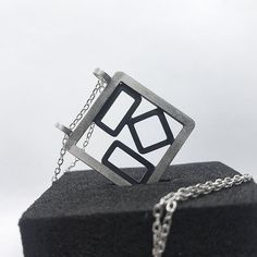 This modern statement pendant in recycled sterling silver is individually designed and made from scratch using traditional silversmithing techniques in my studio in London. Completely made by hand and custom to your personality, it requires up to 2 business days to be dispatched.  Why you need this pendant:  ‣‣ Geometric design with patina for trendy looks ‣‣ Available with matching earrings and ring ‣‣ Perfect for day-to-night outfits ‣‣ All handmade unique present for yourself and your loved ones  ‣‣ Gift boxed with a personalised message card  ‣‣ Free, fast, and secure shipping  ‣‣ 13% OFF with this coupon (excluding Sale items):  https://www.etsy.com/uk/shop/AndyKashtanJewellery?coupon=1STPURCHASE MORE DETAILS: This unique statement pendant is handcrafted from recycled sterling silver Uncommon Gifts, Geometric Pendant Necklace, Unique Silver Jewelry, Personalised Gift Boxes, Made From Scratch, Paper Jewelry, Handmade Jewelry Gift, Uk Gifts, Geometric Pendant