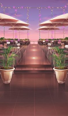 two potted plants sitting on top of each other in front of an outdoor dining area